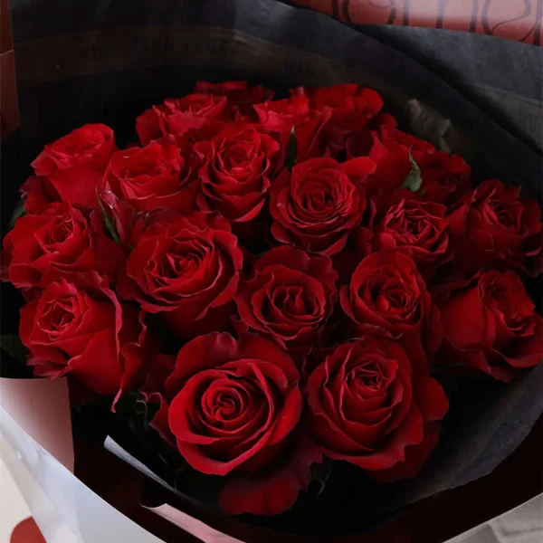 19 red roses fresh petals detail china florist Close-up of 19 fresh red rose petals, showing the velvet texture and high quality of blooms for our professional flower delivery service across China.