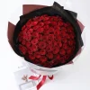 99 red roses fresh velvet petal texture detail Close-up detail of fresh 99 red rose petals, showing the rich velvet texture and premium quality of our blooms for professional China flower delivery.