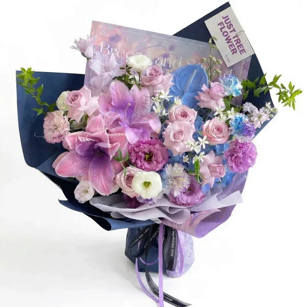Send Flowers to Beijing | Same-Day Delivery China A stunning mixed bouquet featuring large purple lilies, lavender roses, and carnations, wrapped in elegant deep blue and violet paper. Ideal for luxury flower delivery in China.