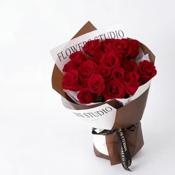 eternal love 19 red roses main Frontal view of 19 premium red roses in brown and white "Flowers Studio" wrapping for China delivery