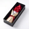 luxury rose box laying view Horizontal laying view of the red roses gift box, demonstrating the lush arrangement inside the premium black box.