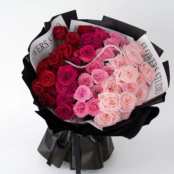 ombre rose bouquet side profile Side view of the luxury ombre rose bouquet, highlighting the professional black studio-style wrapping and sleek ribbon.