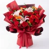 prosperous red lily carnation bouquet main A grand bouquet of red carnations, pink lilies, and orange spray roses in luxury maroon wrapping. Ideal for festive celebrations and birthdays in China.