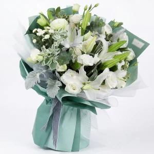pure elegance white lily rose bouquet main A sophisticated pure white bouquet of oriental lilies and roses in refreshing mint green wrapping. Elegant gift for China delivery.