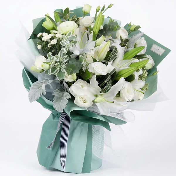 pure elegance white lily rose bouquet main A sophisticated pure white bouquet of oriental lilies and roses in refreshing mint green wrapping. Elegant gift for China delivery.
