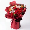 red lily carnation orange rose bouquet side view Side view showcasing the multi-layered maroon wrapping, elegant ribbon, and the grand size of the Prosperous Red mixed bouquet for China delivery.