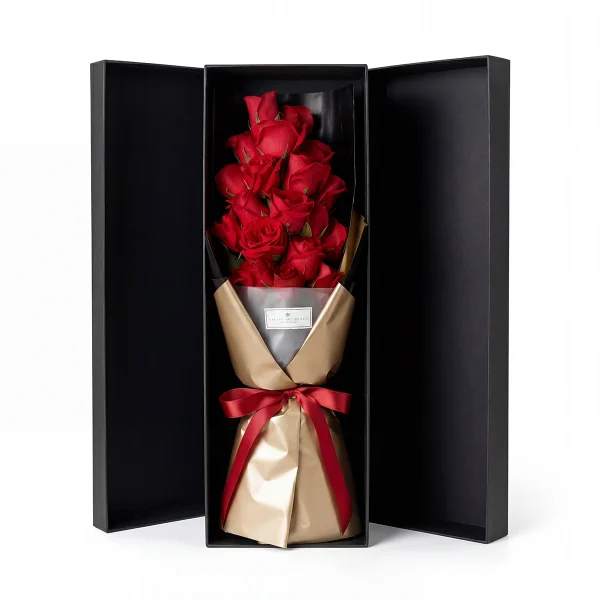 red rose luxury gift box main Frontal view of 19 premium red roses in a luxury black gift box with gold wrapping. High-end flower delivery China.