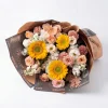 vintage sunflower orchid bouquet flat lay Horizontal laying view of the Retro Romance bouquet, showing the lush abundance and freshness of sunflowers and exotic orchids.
