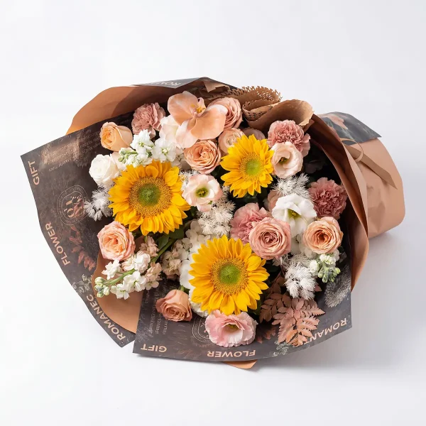 vintage sunflower orchid bouquet flat lay Horizontal laying view of the Retro Romance bouquet, showing the lush abundance and freshness of sunflowers and exotic orchids.